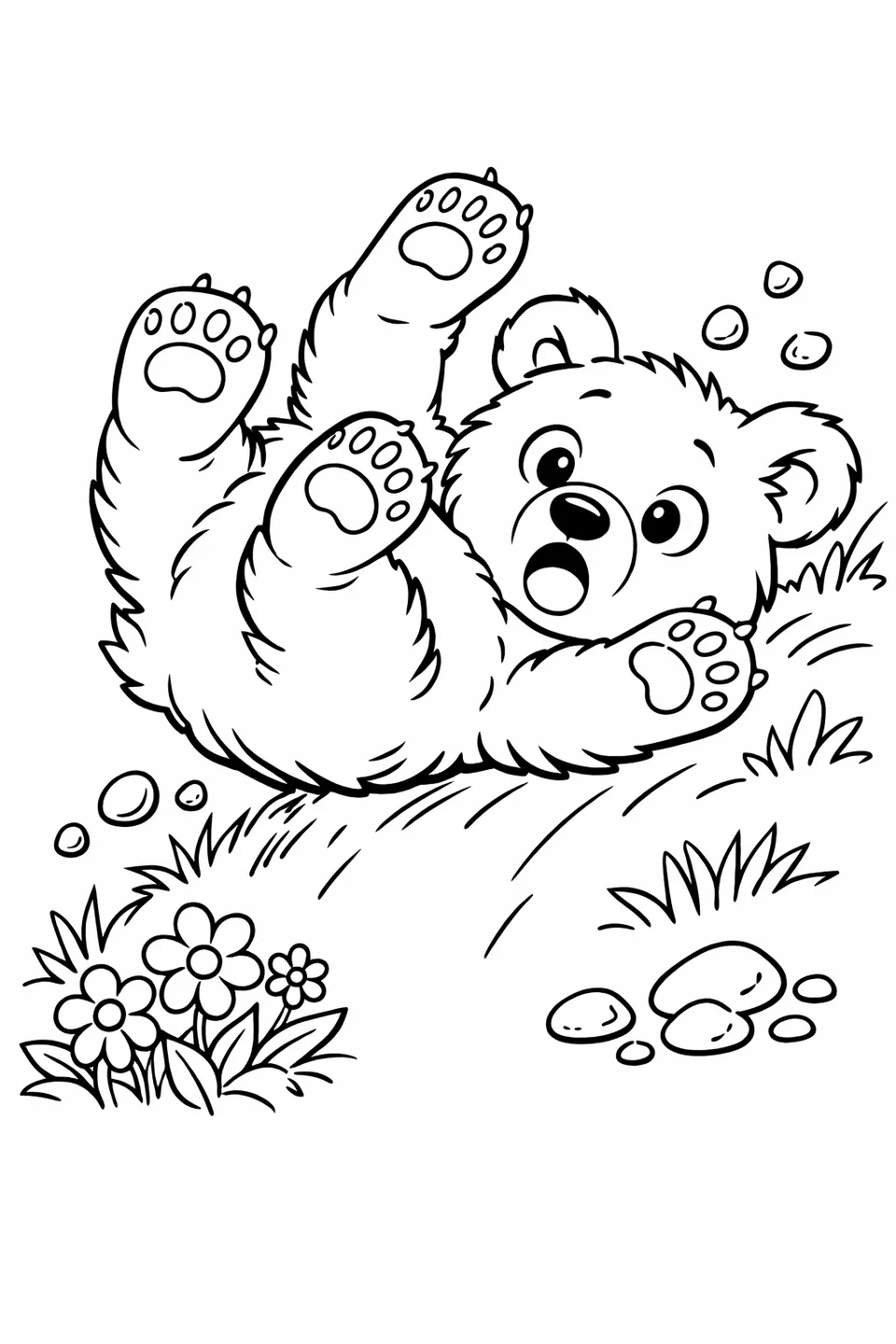 Brown bear cub tumbling down a grassy slope with all four paws in the air and a surprised expression, flowers and pebbles nearby